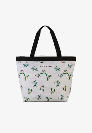 Grote boodschaptas met zwarte handvatten, witte stof met een bloemenpatroon en geometrisch design, gebrandmerkt met "Frida Kahlo."