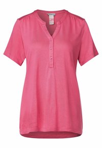 Camicia rosa a maniche corte con scollo a V e pattina con cinque bottoni, caratterizzata da un tessuto morbido e leggere arricciature sulle spalle per un tocco di dettaglio in più.