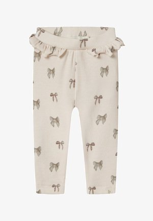 Ribbade bomullsleggings i mjuk beige med en volangmidja, med ett upprepat sämnönster i dämpade färger. Mjuk textur, slim fit.