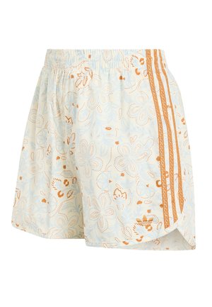 Shorts de couleur claire avec une taille élastique, des motifs floraux et trois bandes orange texturées sur un côté.