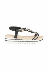 Sandalo nero con strappi e upper intrecciata, impreziosito da borchie argento e strass. Presenta una suola bianca con accenti di glitter neri.
