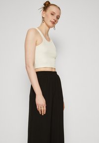 Vero Moda Tall VMALVA WIDE - Trousers - black