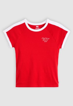 Red short-sleeve t-shirt with white raglan sleeves. Features a small white logo on the chest. Made from a soft cotton material.
