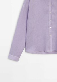 Lavender button-up shirt with long sleeves, crafted from lightweight fabric, featuring a relaxed fit and subtle texture.