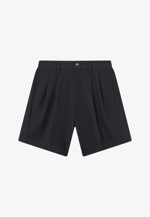 Sacos de marinha em tecido leve, com pregas, fecho de botão e bolsos laterais. Corte straight com uma textura suave.