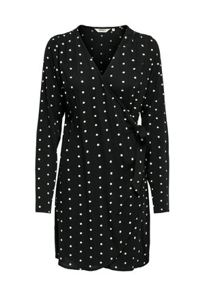 Robe noire à manches longues avec des pois blancs, ceinture à la taille et décolleté en V. Tissu doux et léger avec une belle fluidité.