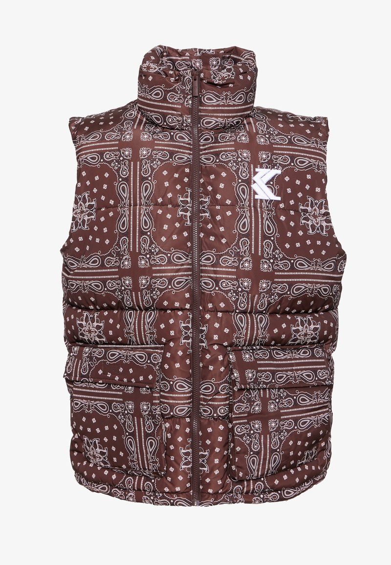 Brązowa pikowana kamizelka z wzorem bandany w białym kolorze, wysoki kołnierz, zapięcie na zamek z przodu oraz wiele przednich kieszeni.