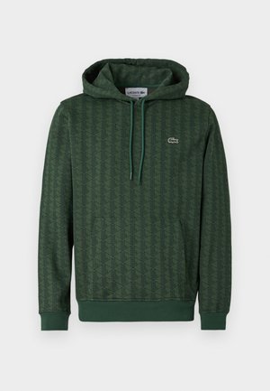 Groene hoodie met een geometrisch patroon, trekkoordcapuchon en ribgebreide manchetten. Lacoste-logo in contrasterende kleur op de borst.