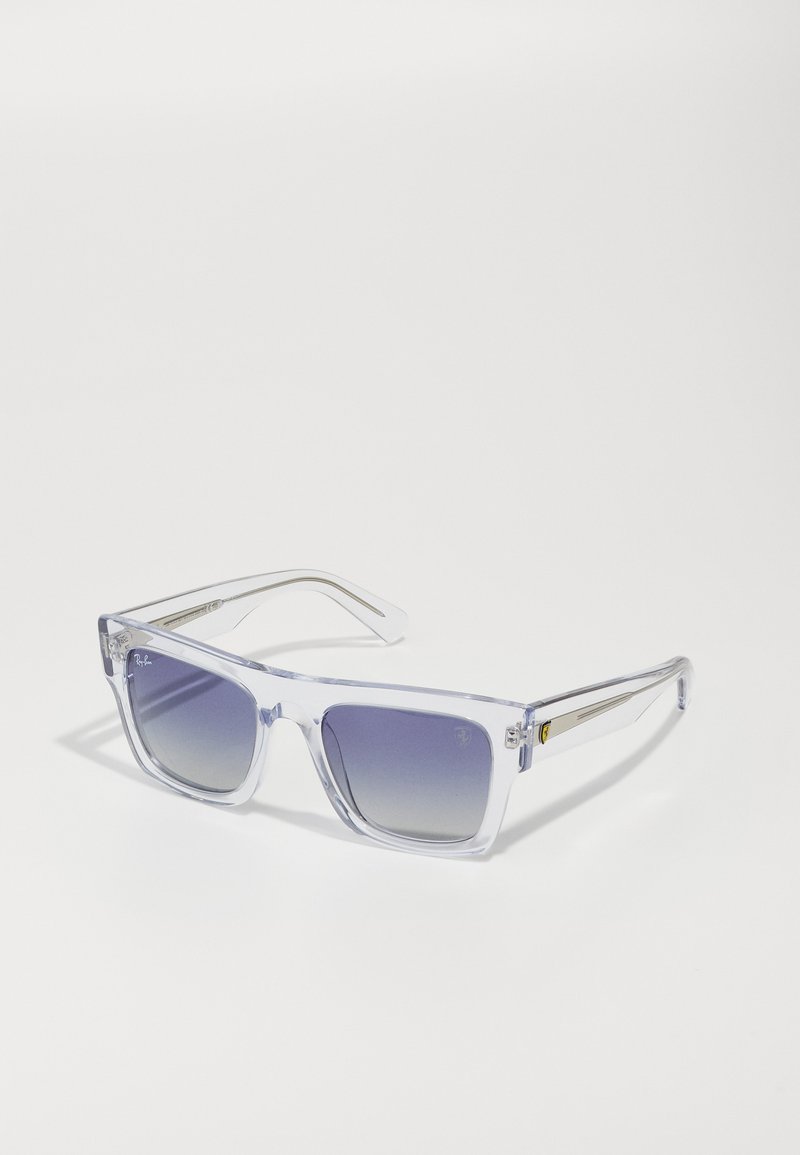 Clear rectangular sunglasses with gradient dark purple lenses, transparent frames, and gold accents on the temples.