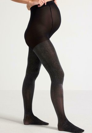 Sorte strømpebukser med en glitrende tekstur, der har en høj talje, og som går fra gennemsigtig øverst til uigennemsigtig ved benene.