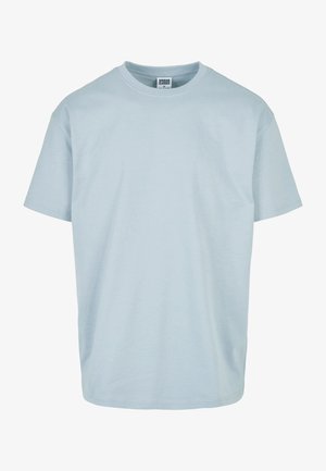 Gaiši zila īsu piedurkņu T-krekls, izgatavots no mīksta kokvilnas materiāla. Tam ir apaļa kakla izgriezuma forma un brīvs piegriezums, bez redzamām rakstām vai rotājumiem.