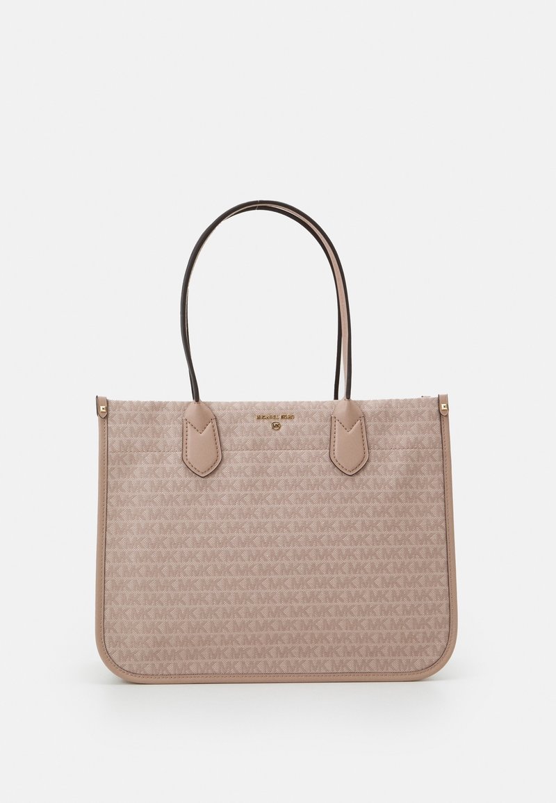 Sac cabas beige Michael Kors en tissu à logo imprimé, deux fines bretelles et plaque logo dorée au centre devant.