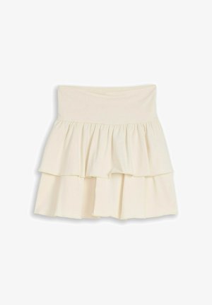 Cream-colored, tiered, ruffled mini skirt with a wide, high waistband and a flowy, layered design.