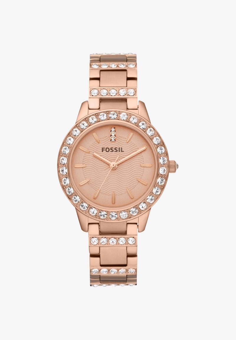 Montre-bracelet Fossil en or rose avec des accents en cristal sur la lunette et le bracelet, présentant un cadran minimaliste avec des index bâtons et trois aiguilles.