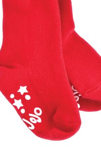 Calze in cotone rosso con stelle e cerchi bianchi stampati sulla punta. Texture morbida, design alla caviglia.