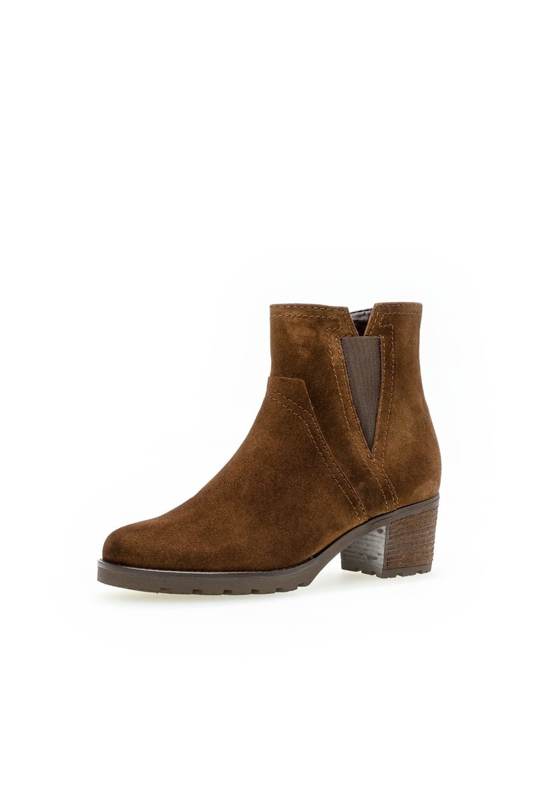 Hnědé semišové kotníkové boty s nízkým blokovým podpatkem, elastickými bočními panely a hladkým povrchem. Mají kulatou špičku a švy jako ozdobu.