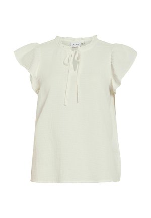 Blouse blanche à manches courtes avec col à volants et détail de nouage au niveau de l'encolure, en tissu léger texturé.