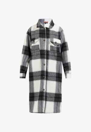 Fekete-fehér kockás ingdzseki puha anyagból, gombos elülső résszel, két mellzsebbel és hegyes gallérral.