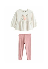 Light beige long-sleeve top with a bunny design and pink accent, paired with pink leggings featuring a gold star pattern.