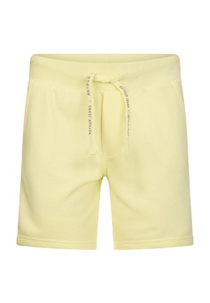 Hellgelbe lässige Shorts mit elastischem Bund und Kordelzug, bedruckt mit "Retour Jeans", vordere Taschen und mittlere Oberschenkellänge.