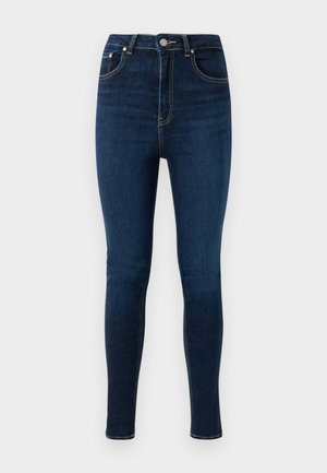 Skinny jeans in dark blue denim with a high waist, featuring a front button closure, two front pockets, and a smooth texture.
