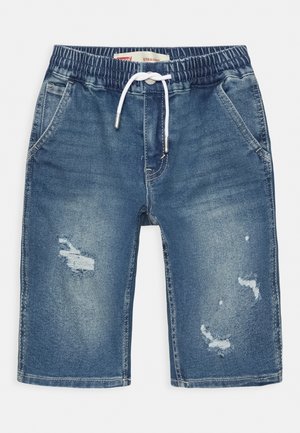 Short en denim bleu avec taille élastique, cordon blanc, poches avant et détails déchirés sur les deux jambes.