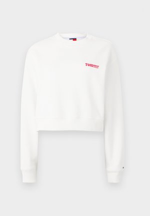 Witte cropped sweatshirt gemaakt van zachte stof. Bevat een rode "TOMMY" logo op de borst en ribbelboorden. Eenvoudig, schoon ontwerp.