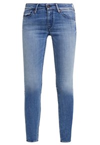 Smaljeans i blå denim, med medeltvätt och urtvättningar, fem fickor samt metalldroppe och dragkedjestängning.