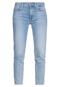 Jasnoniebieskie jeansy skinny z denimu, z wysokim stanem, pięcioma kieszeniami i mosiężnymi detalami. Gładka tekstura.