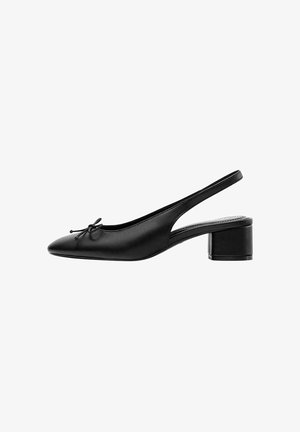 Black leather slingback shoe with low block heel and small bow detail on pointed toe, side view on white background.
