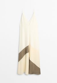 Long sleeveless dress with thin straps, v-neck, and diagonal beige and brown color blocks on a cream background.