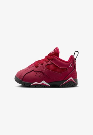 Red athletic shoe with smooth and textured materials, featuring mesh panels, laces, and a black rubber sole with white accents.