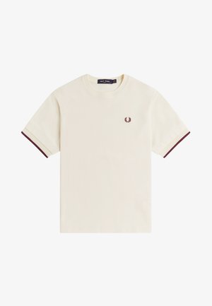 Camiseta de manga corta color crema con ribete burdeos en las mangas y pequeño logo de corona de laurel burdeos en el lado izquierdo del pecho.