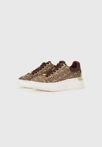 Sneakers with a woven brown pattern, gold eyelets, and a textured brown accent. Features a white sole with a slight platform.