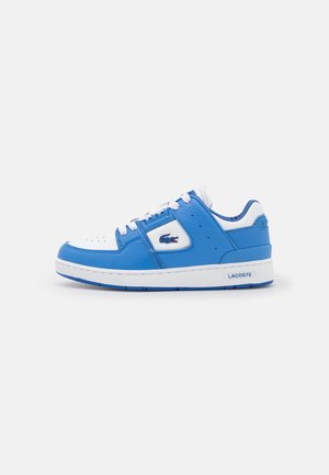 Blue leather sneakers with white accents, perforated toe, lace-up design, and Lacoste branding on the side and heel.
