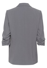 Blazer gris avec revers structurés ; manches bouffantes et froncées, avec une texture lisse. Design épuré et ajusté sans attaches visibles.