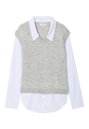 Light blue and white striped long-sleeve shirt layered under a gray sleeveless V-neck knit sweater vest.