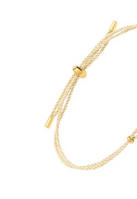 Regulowana bransoletka w kolorze złotym z plecionym metalicznym sznurkiem, ozdobiona gładkimi okrągłymi elementami i dwoma smukłymi zakończeniami.