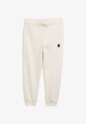 Licht beige sweatpants van zachte stof, met een elastische tailleband met een trekkoord en zijzakken. Zwart logo-patch op het been.