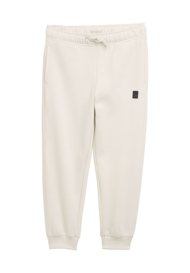 Licht beige sweatpants van zachte stof, met een elastische tailleband met een trekkoord en zijzakken. Zwart logo-patch op het been.