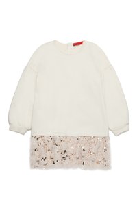 Kremfarge langermet topp med puffede ermer, med en fluffy rosa paljettkant nederst og glidelås bak.
