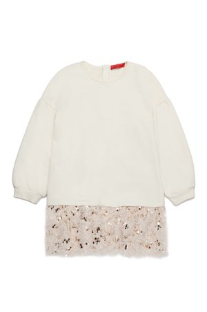 Kremfarge langermet topp med puffede ermer, med en fluffy rosa paljettkant nederst og glidelås bak.