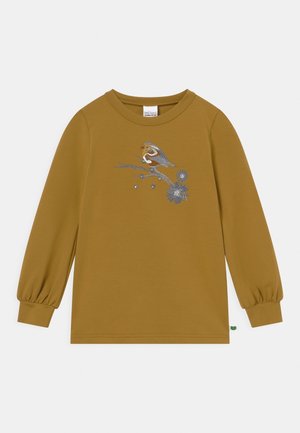 Langærmet skjorte i sennepsgul i blødt stof med broderet fugl og blomstermotiv foran. Puffærmer og rund hals.