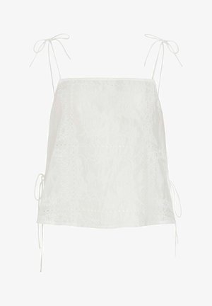 Blusa blanca sin mangas con tirantes para atar y motivos florales calados bordados en tela ligera.