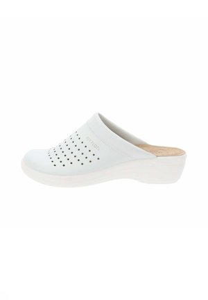 Zoccoli bianchi senza chiusura con design perforato e soletta in sughero. I bordi morbidi e arrotondati e la suola bianca leggermente elevata offrono comfort e supporto.