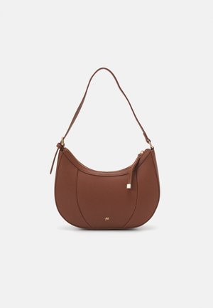 Brown faux leather shoulder bag with curved shape, minimal stitching, and a gold-tone hardware accent. Features a top zipper closure and adjustable strap.