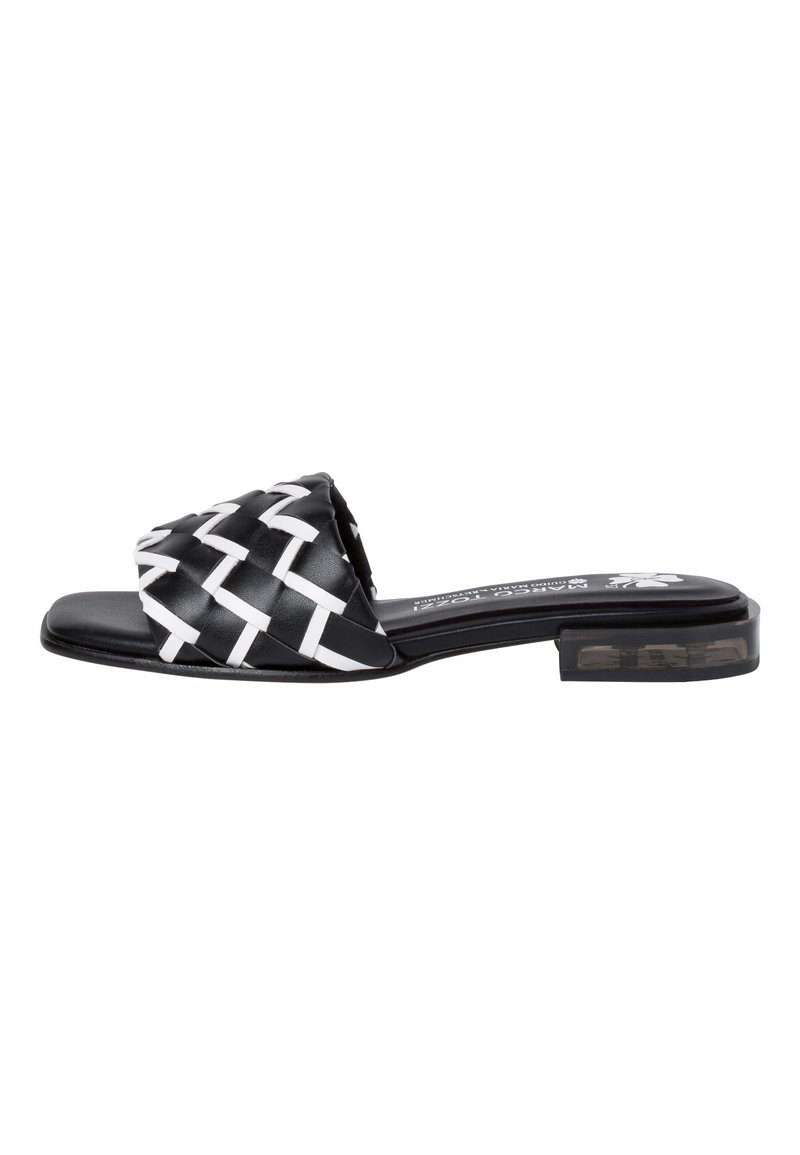Black and white woven slide sandal with a low block heel, featuring a textured fabric upper and smooth sole. No visible branding present.