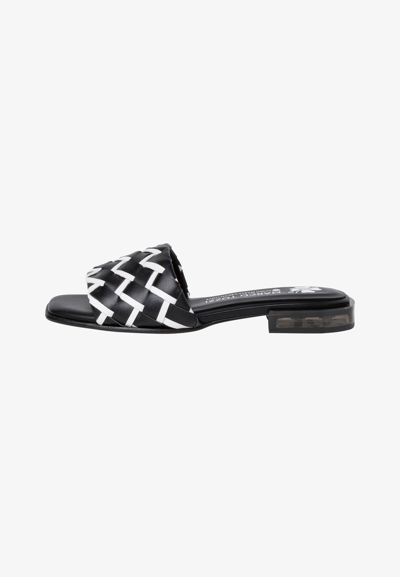 Black and white woven slide sandal with a low block heel, featuring a textured fabric upper and smooth sole. No visible branding present.