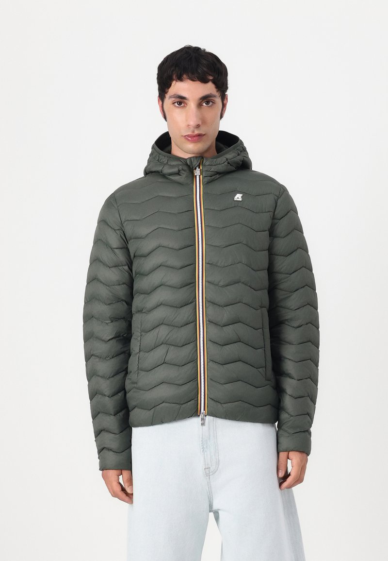 Dark green puffer jacket with zigzag quilted pattern, hood, and two-tone zipper featuring orange and yellow accents.