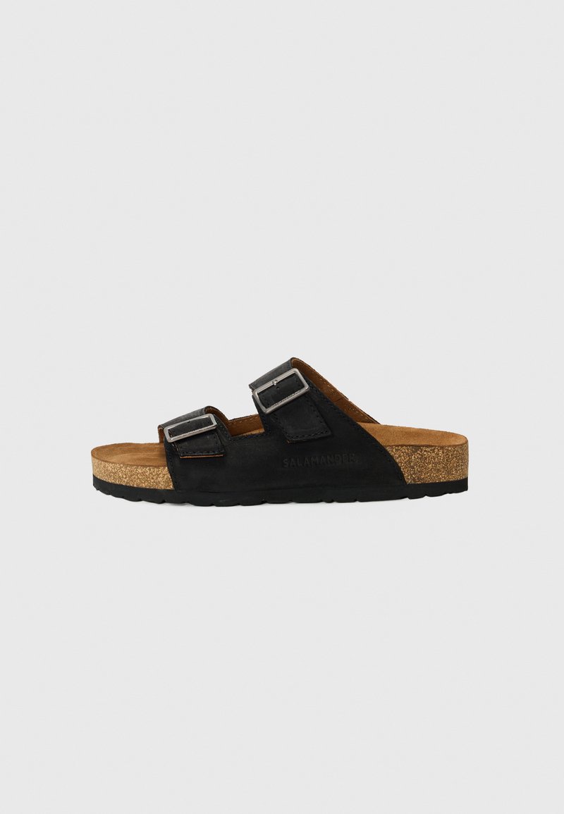 Black slide sandal with two adjustable straps, cork footbed, and rubber sole. Features soft suede upper with embossed logo detail.